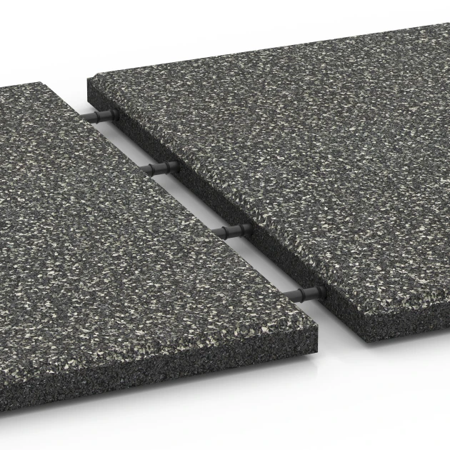 Le gros plan sur le système de connexion des revêtements de sol WARCO 6413 - Dalle amortissante – 90 cm en couleur Granit gris foncé. Les dimensions 50 x 50 x 3 cm | 0,25 m².
