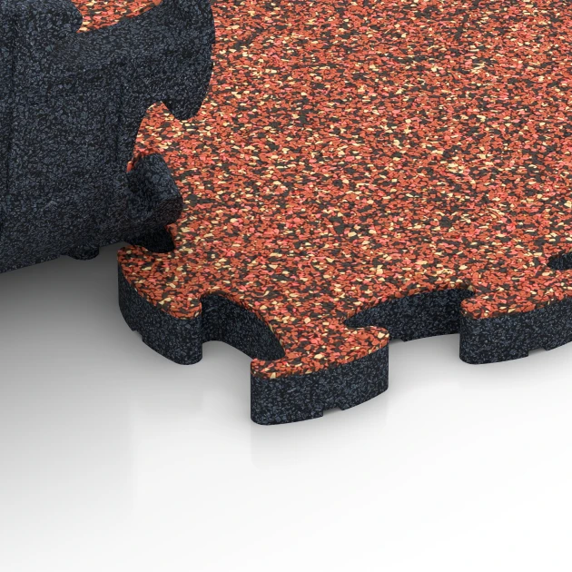 Le gros plan sur le système de connexion des revêtements de sol WARCO 6953 - Dalle terrain multisport en couleur Etna. Les dimensions 44,6 x 44,6 × 2,8 cm.